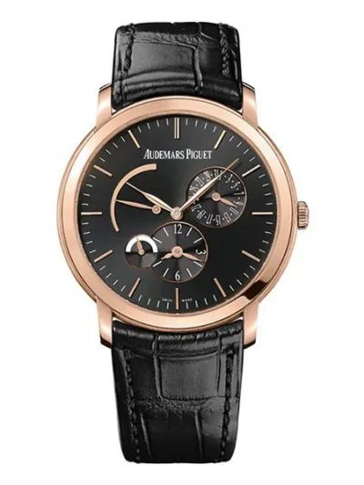 15126BC.OO.D002CR.01 – Jules Audemars Ultra Thin 18 carat white gold case with a black leather strap. Fixed bezel. Grey dial with grey hands and index-Roman numerals hour markers. Dial Type: Analog. Hand wind movement. Scratch resistant sapphire crystal. Skeleton transparent exhibition see through case back. Case size: 44 mm. Round case shape. Band width: 18 mm. Functions: hour, minute. Luxury watch style. Watch label: Swiss Made. Audemars Piguet Jules Audemars Grey Dial Men’s Watch 15126BC.OO.D002CR.01.  WATCH SPECIFICATIONS Brand: Audemars Piguet Ref. 15126BC.OO.D002CR.01 Collection: Jules Audemars Case Material: 18k white gold case, Skeleton Transparent Exhibition See Through case back Movement: hand wind movement Case shape:  Round Bracelet: black leather strap Crystal: scratch resistant sapphire crystal Dial: grey dial Bezel: fixed bezel Diameter: 44mm